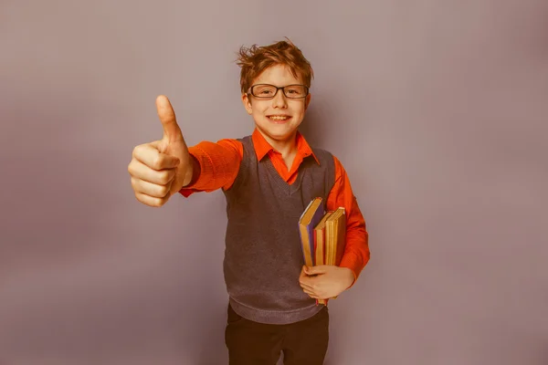 European-looking  boy of ten years in glasses showing thumb up, — Stock Photo, Image