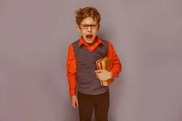 European-looking  boy of ten years in glasses opened his mouth s — Stock Photo, Image