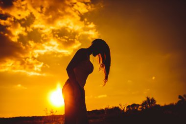 European appearance young woman lowered her head hair down at su