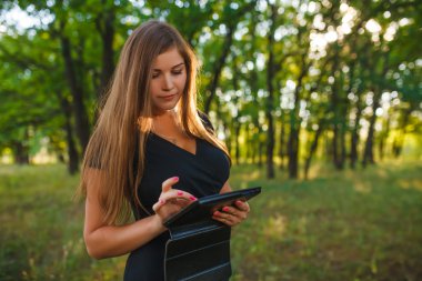 Girl European appearance young brown-haired woman in a black dre