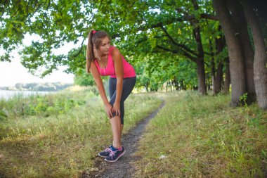 Girl European appearance young brown-haired woman in a pink shir