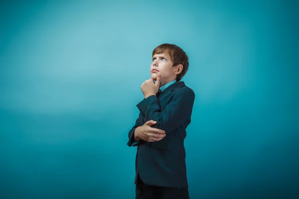 European appearance teenager boy in a business suit thoughtful h — Stok fotoğraf