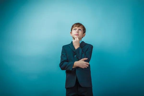 European appearance teenager boy in a business suit thoughtful h — Stock Photo, Image