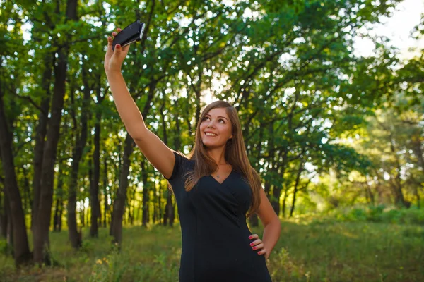 Girl European appearance young brown-haired woman in a black dre — Stock fotografie