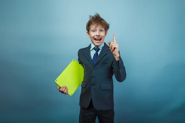 Teen boy businessman of European appearance with a shaggy head i — стокове фото