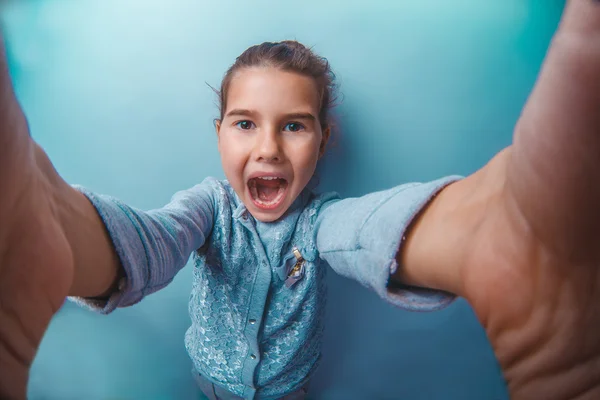 The girl child is seven years old in a blue sweater European app — Φωτογραφία Αρχείου
