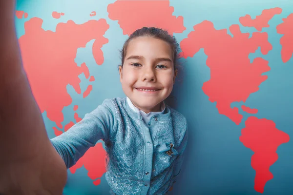 Girl teen shouting stretched her arms behind world map background — Stok fotoğraf