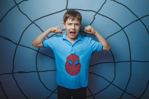 Spider man superhero teen boy raised his arms shouting skin stren — Stock Photo, Image