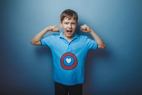 Boy superhero teenager raised his arms shouting power to vest th — Stock Photo, Image