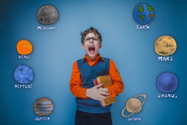 boy with glasses and a gray vest screaming opened his mouth plan