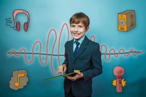 Boy in suit business style smiling and holding a finger on the s — Stockfoto