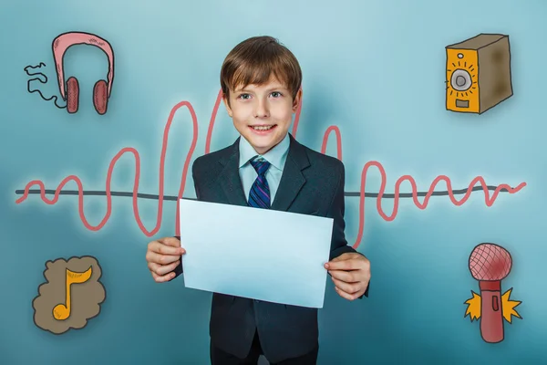 Boy teenaged businessman smiling and holding a white sheet of pa — ストック写真