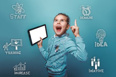 Teen baby girl holding a tablet in her hand raised index finger