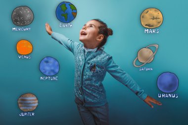 Teen girl shows a happy flight of planets in the solar system as