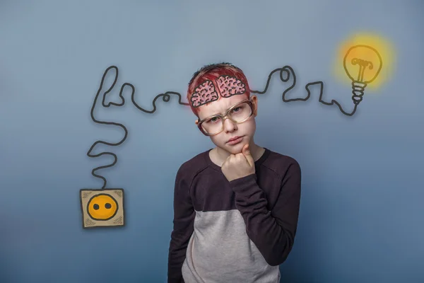 Teenage boy in glasses holding hand on chin and thinking brain b — Φωτογραφία Αρχείου