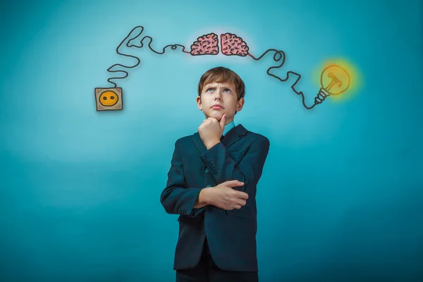 Teenage boy thinking thoughtful hand to face the charge of initi