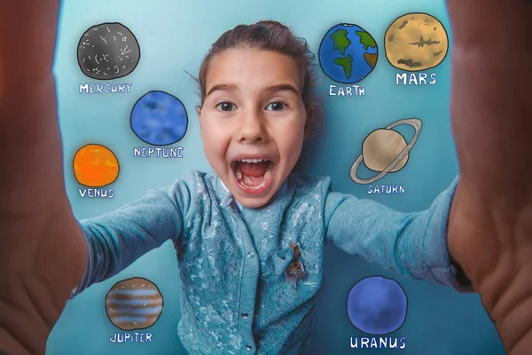 Teen girl making a self laughing mouth open planet of the solar