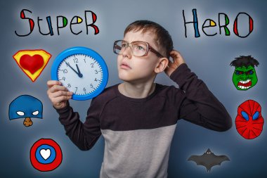 retro style boy with glasses holding a clock hand scratches his