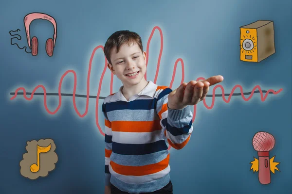 Teenage boy smiling and holding his hand on a sound wave music r — Zdjęcie stockowe