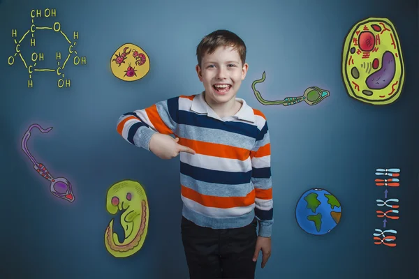 Teenage boy laughing and pointing her finger down a set of icons — Stock fotografie