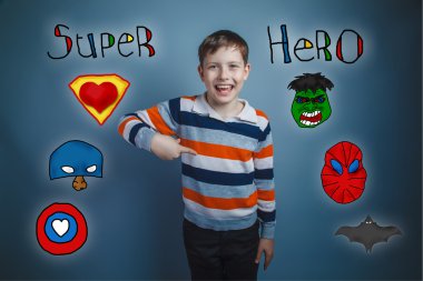 Teen boy points his finger down and laughs superhero super power
