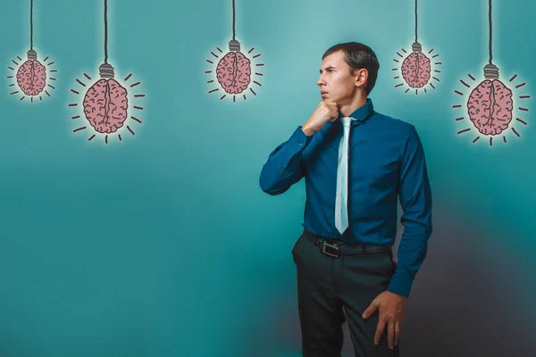 A man business style wondering looks toward his chin propped won — Stock Photo, Image