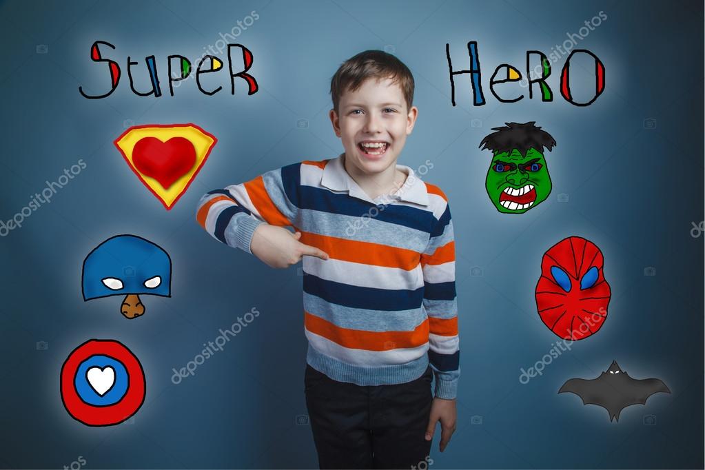 Teen boy points his finger down and laughs superhero super power at the photo studio Icons hero