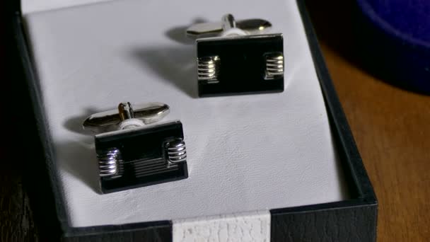 Man Cufflinks are in box on the table — Stock Video