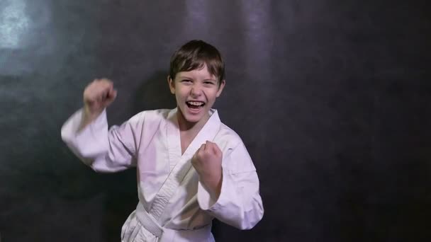 Karate kid boy screaming success teenager victory rejoices — Stock Video