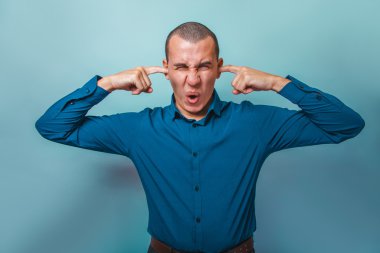 a man of European appearance thirty  years his ears fingers show