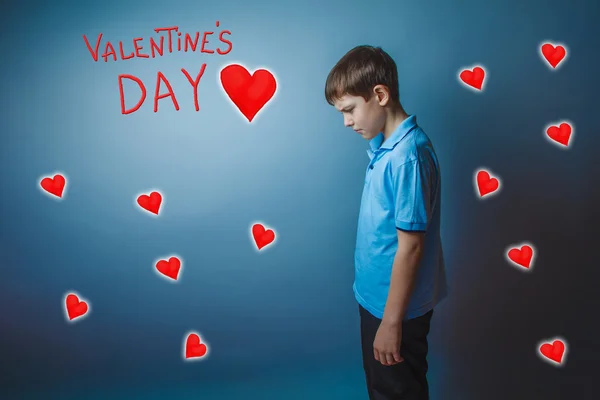 Adolescence boy lowered his head is Valentines Day celebration — Stock Photo, Image