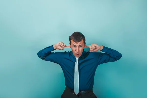 A man  of European appearance thirty years his ears fingers on a — Stock Photo, Image