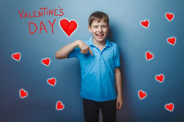 Boy laughing teenager pointing down Valentines Day celebration
