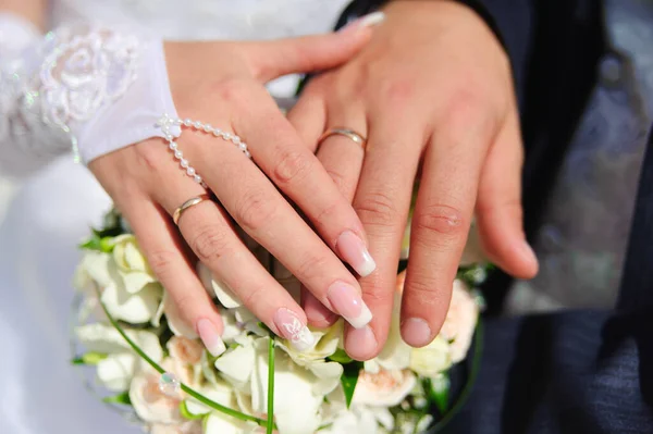 Hands Newlyweds Lie Wedding Bouquet Royalty Free Stock Photos