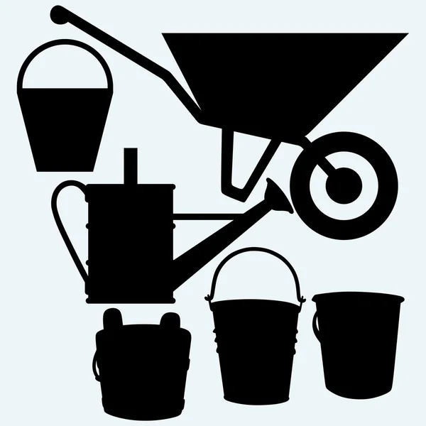 Zahradní kolečko, konev a kbelíky — Stockový vektor