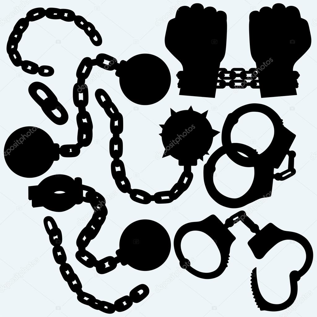 Hands chained in a chain, metal shackles and handcuffs
