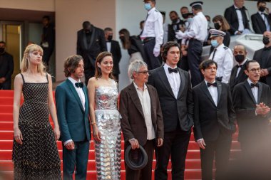 CANNES, FRANCE - JULY 06, 2021: Angele, Simon Helberg, Marion Cotillard, director Leos Carax, Adam Driver, Ron Mael and Russel Mael attend the 