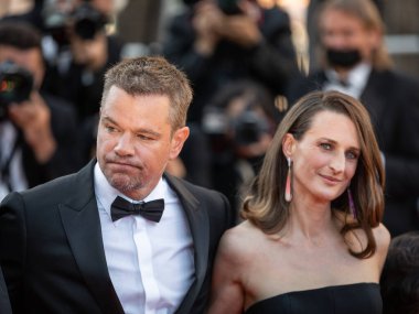 CANNES, FRANCE - JULY 08, 2021:  US actor Matt Damon and French actress Camille Cottin pose as they arrive for the screening of the film 