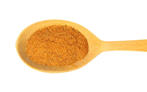 Some spices on a wooden spoon. isolated on a white background — Stock Photo, Image