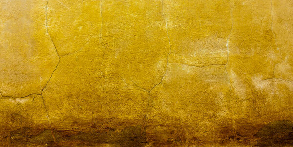 Трещины и грязные бетонные стены текстуры. желто-коричневый тон