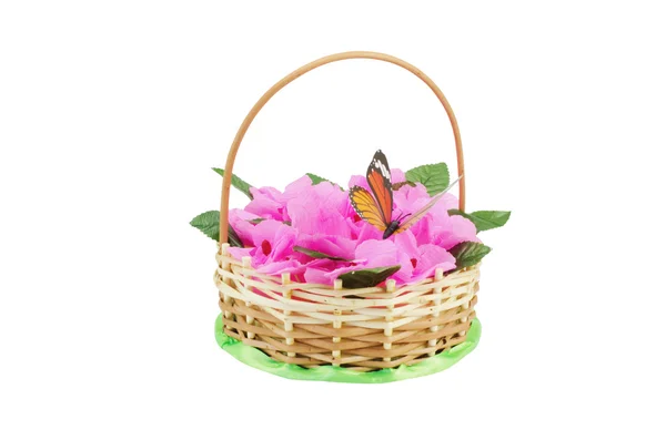 Beautiful wattled basket with artificial flowers — Stock Photo, Image