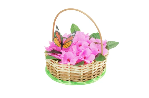 Beautiful wattled basket with artificial flowers — Stock Photo, Image