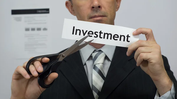 Businessman Cuts Investment Concept Stock Picture