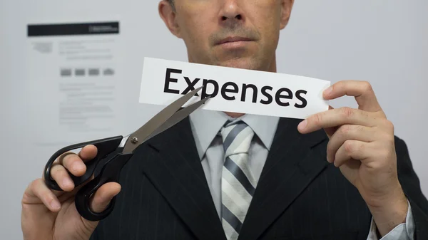 Businessman Cuts Expenses Concept Stock Photo