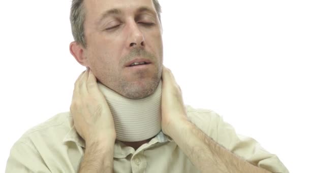 Male In Neck Support Brace With Pain — Stock Footage Male In Neck Support Brace With Pain Royalty Free Stock Video