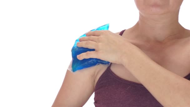 Woman Puts Cold Pack on Shoulder Front View — Stock Video
