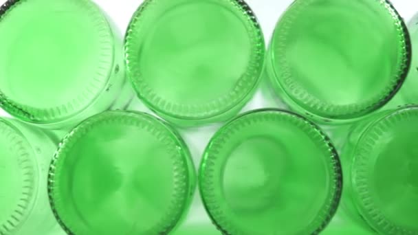 Green Bottle Bottoms Closeup Dolly — Stock Video