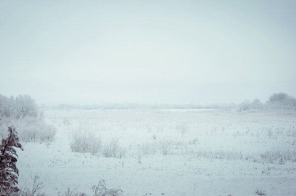 Winter fog in rural areas in Russia