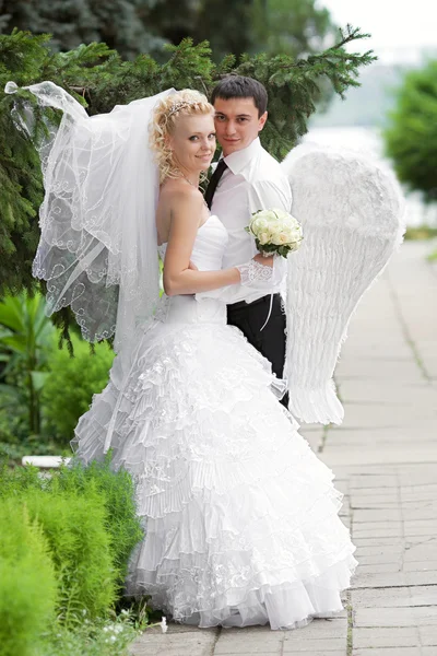 Couple in love bride and groom together in bridal summer day enjoy a moment of happiness and love — Stock Photo, Image