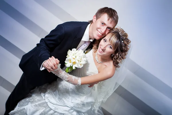 Happy bride and groom in the  hotel hall Royalty Free Stock Images